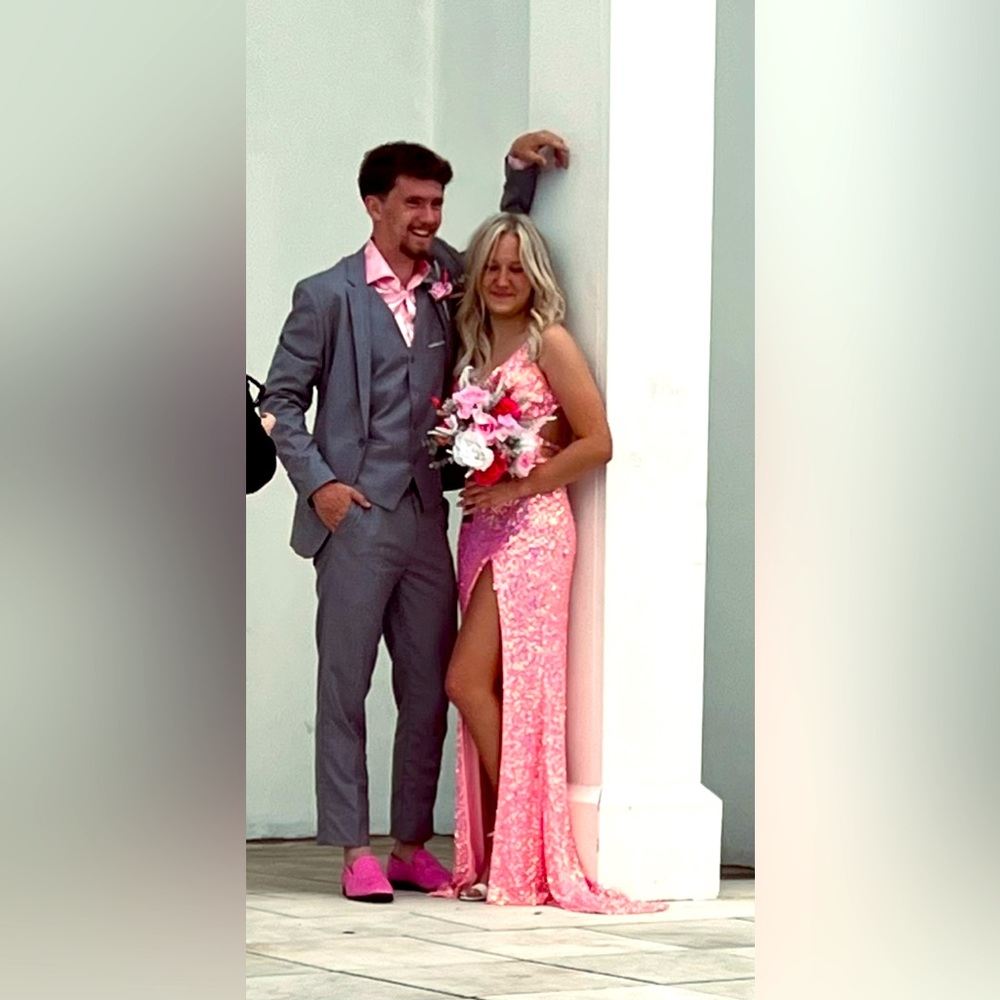 Pink Prom dress with a leg slit and cut outs on the back
